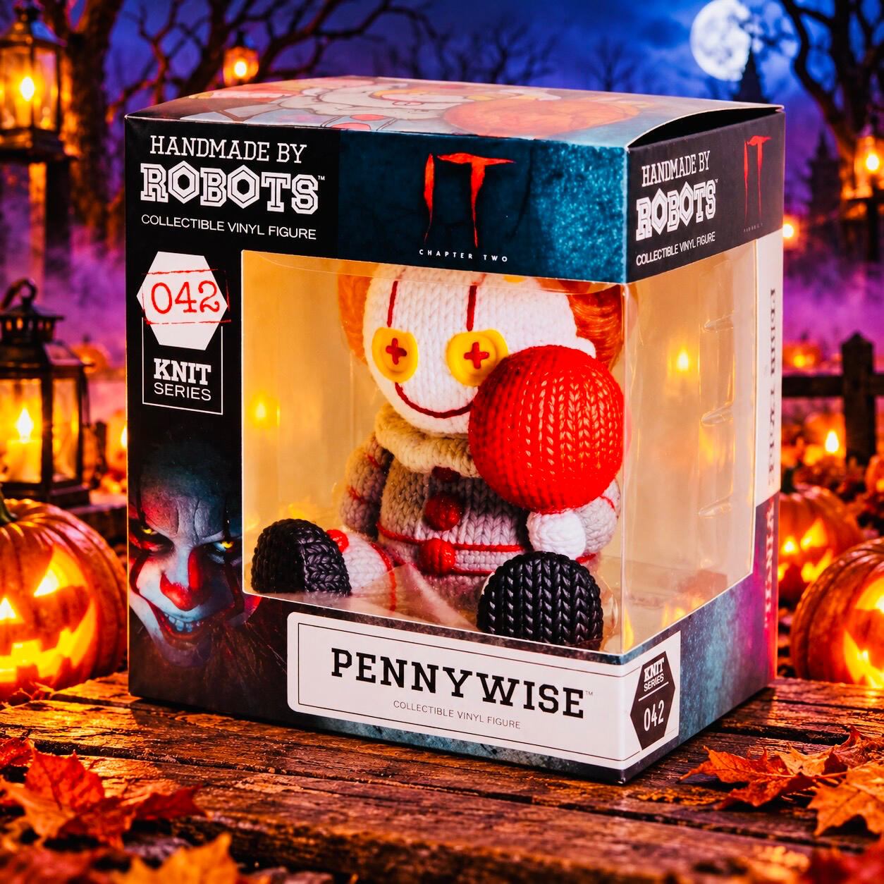 Pennywise #042 — Handmade by Robots Boxed Pennywise figure holding a red balloon, surrounded by glowing pumpkins beneath a moonlit purple sky.