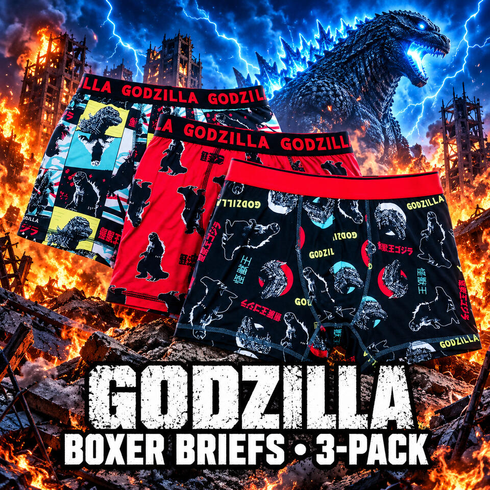 Three pairs of Godzilla boxer briefs in red, black, and multicolor prints, displayed against a burning city with blue lightning.