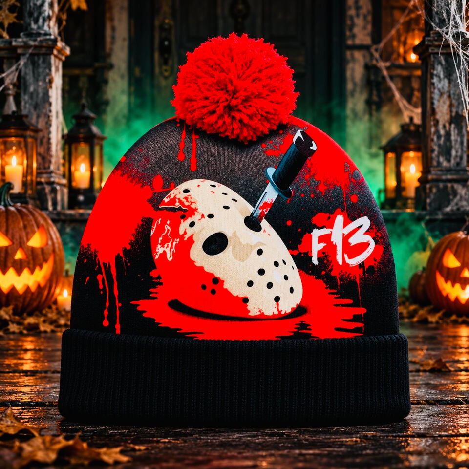 Friday the 13th Pom-Pom Beanie Black and red Friday the 13th beanie featuring a hockey mask graphic and red pom-pom, surrounded by Halloween pumpkins and lanterns.